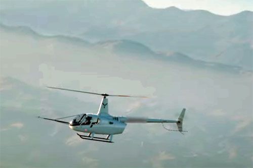 Lekki śmigłowiec Robinson R66 w pierwszym automatycznym lądowaniu w trybie autorotacji z wykorzystaniem FlightOS / Zdjęcie: Skyryse