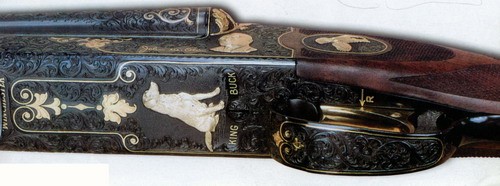Winchester Model 21 numer W 9190 The Grand Royal, z doskonałym wręcz grawerunkiem, wyprodukowany na cześć Johna M. Olina. Jak widać, ulubionym psem właściciela Winchestera był labrador King