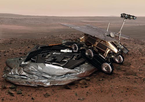 Europejski łazik ExoMars po tradycyjnym lądowaniu zjeżdża z platformy na powierzchnię Marsa, widoczne opróżnione poduszki powietrzne / Ilustracja: ESA